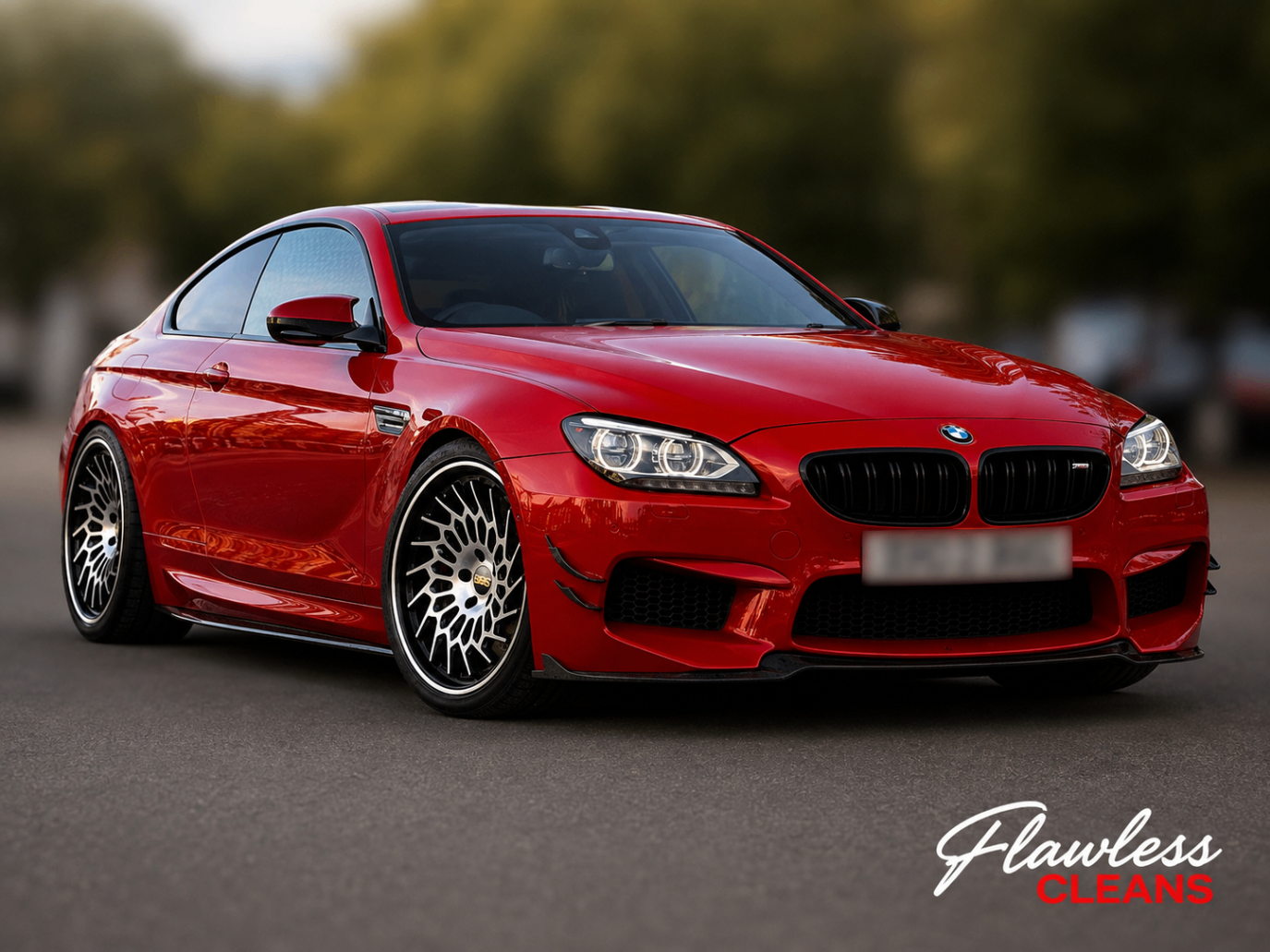 Red BMW M6 coupé detailed with polished alloy wheels