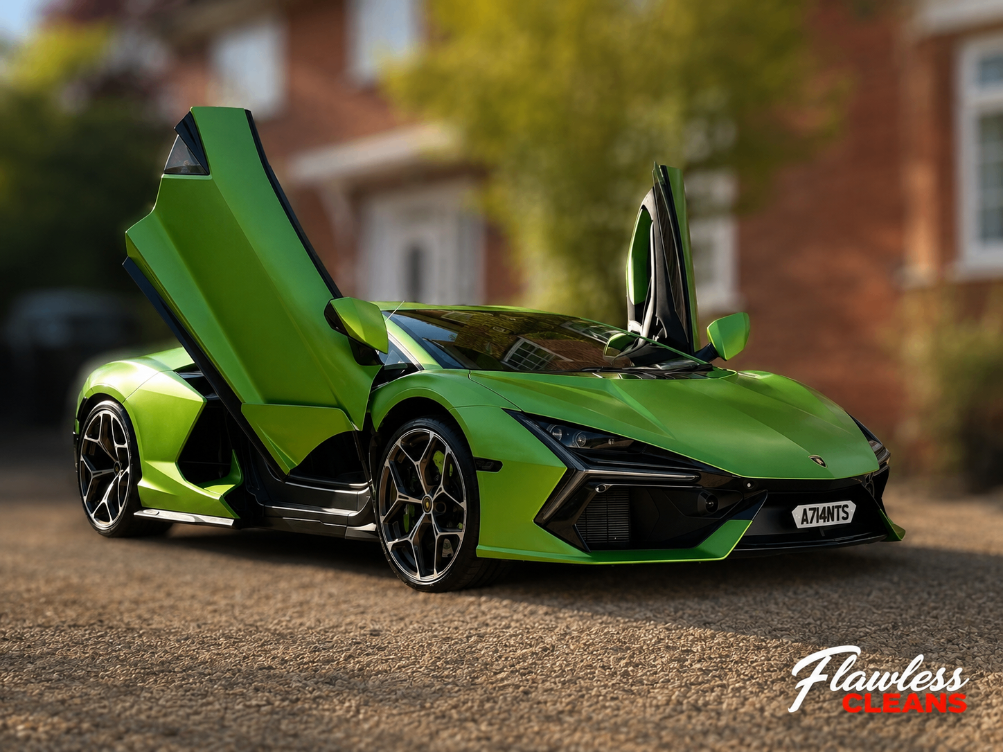 Green Lamborghini Revuelto with doors open after a full detail